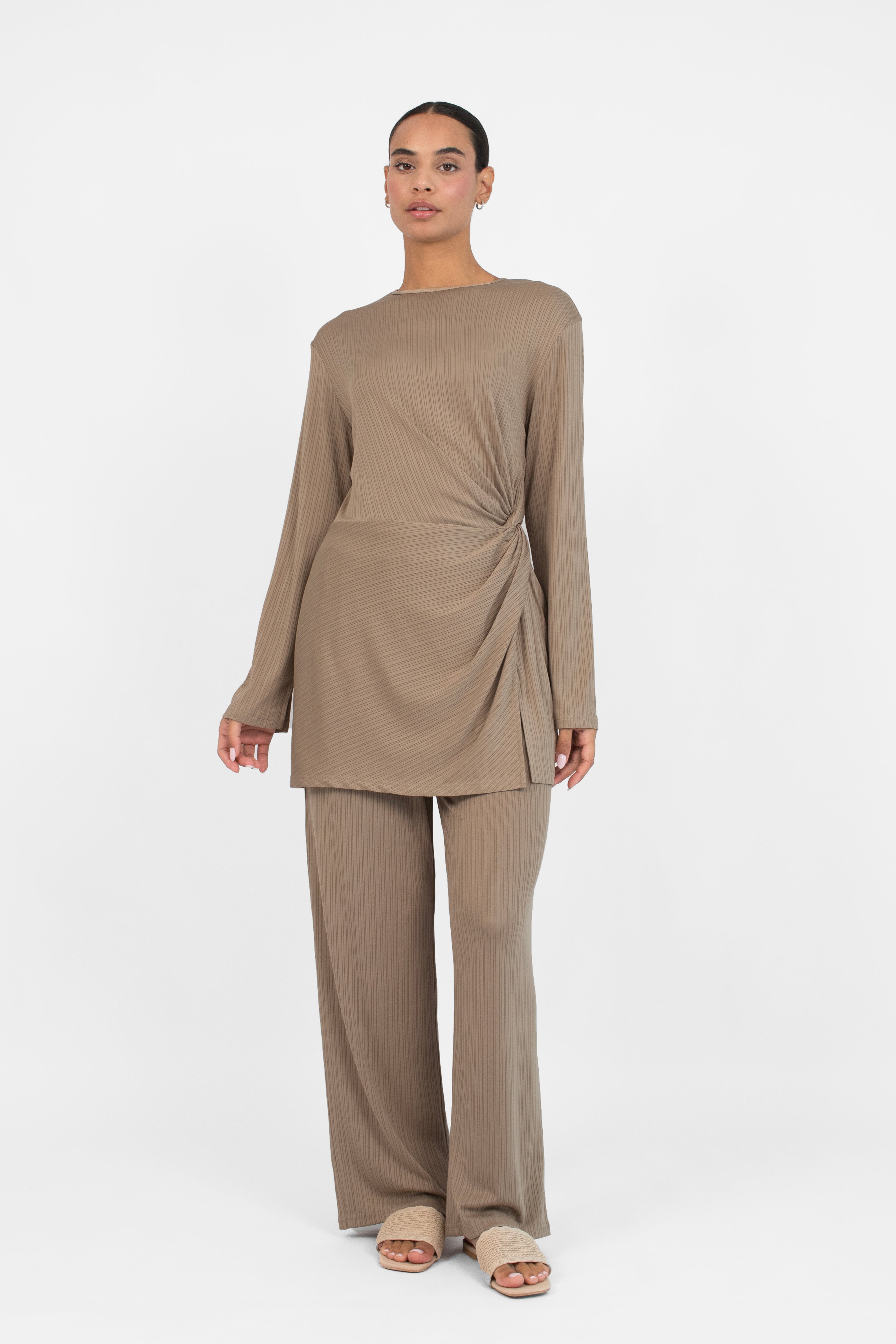 Colour: Taupe. A front pose of a girl in a Ribbed Side Twist Top.