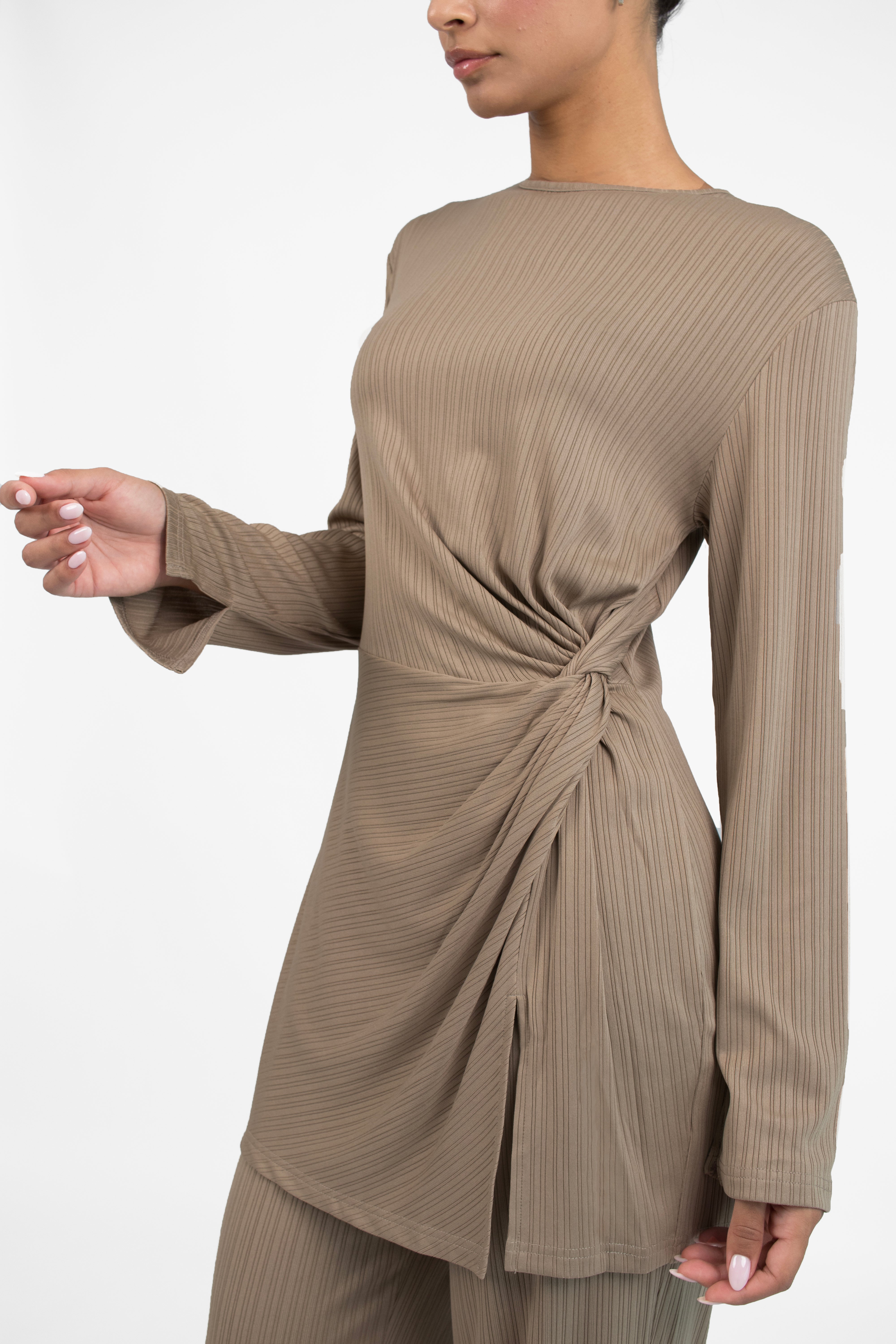 Colour: Taupe. A close up of a model showing a Ribbed Side Twist Top.