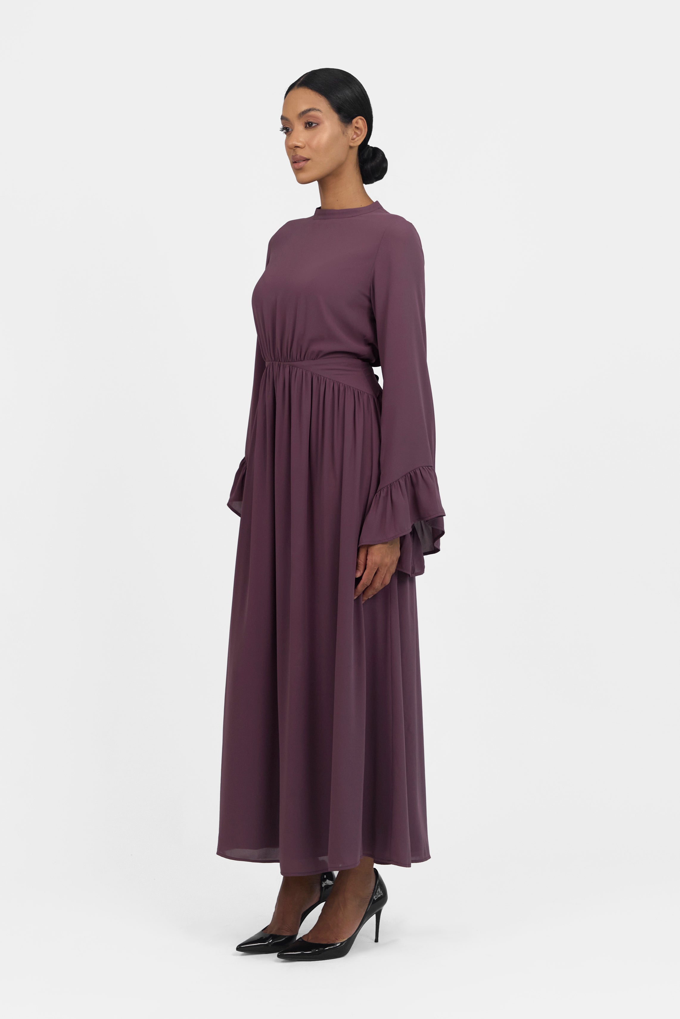 A side pose of a model wearing a Butterfly Sleeve Chiffon Dress 	Colour: Fig