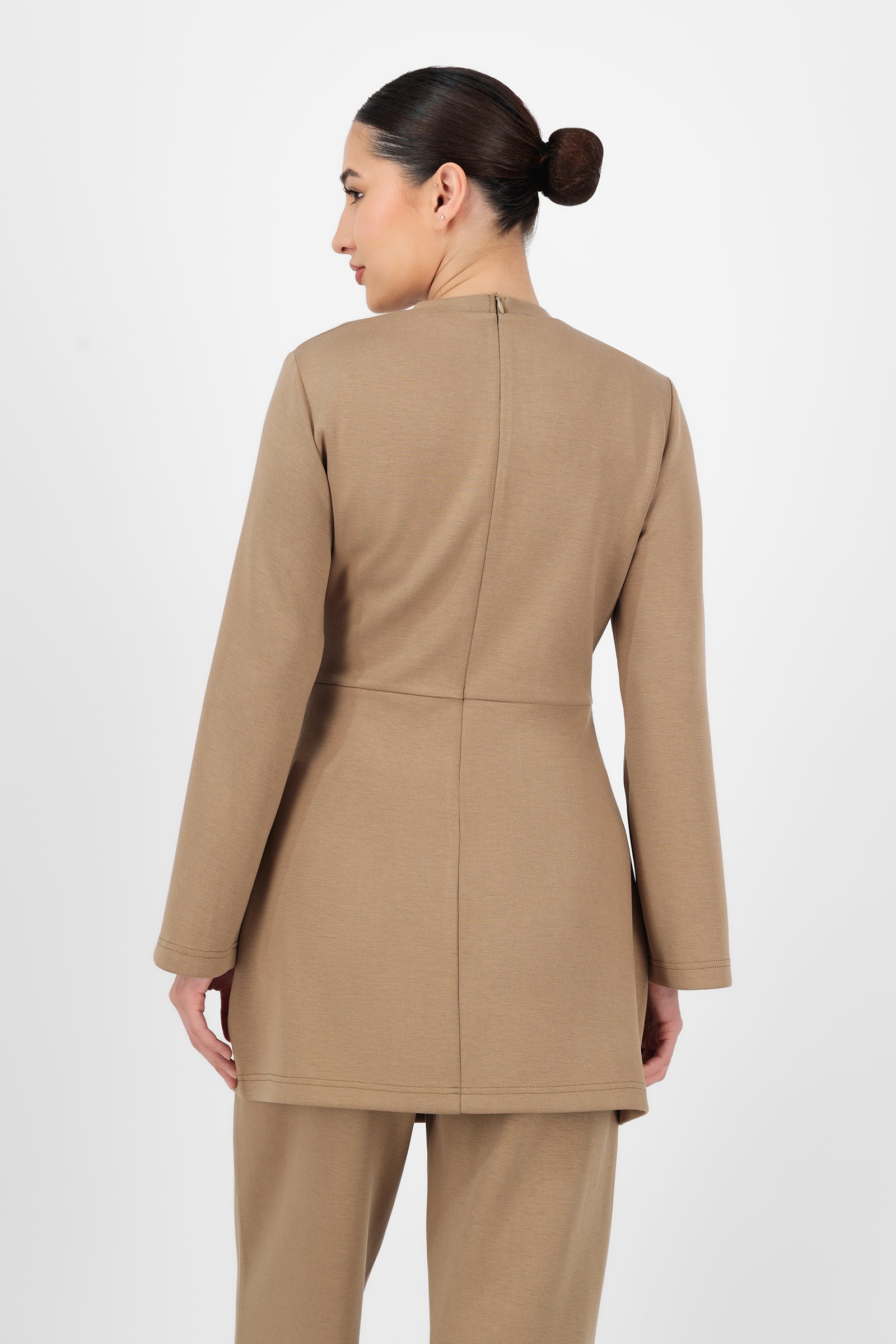 Back view of the Buttery Side Ruched Tunic in Toffee highlighting the smooth fit and modest length that keep this piece polished within tunic clothing styling.