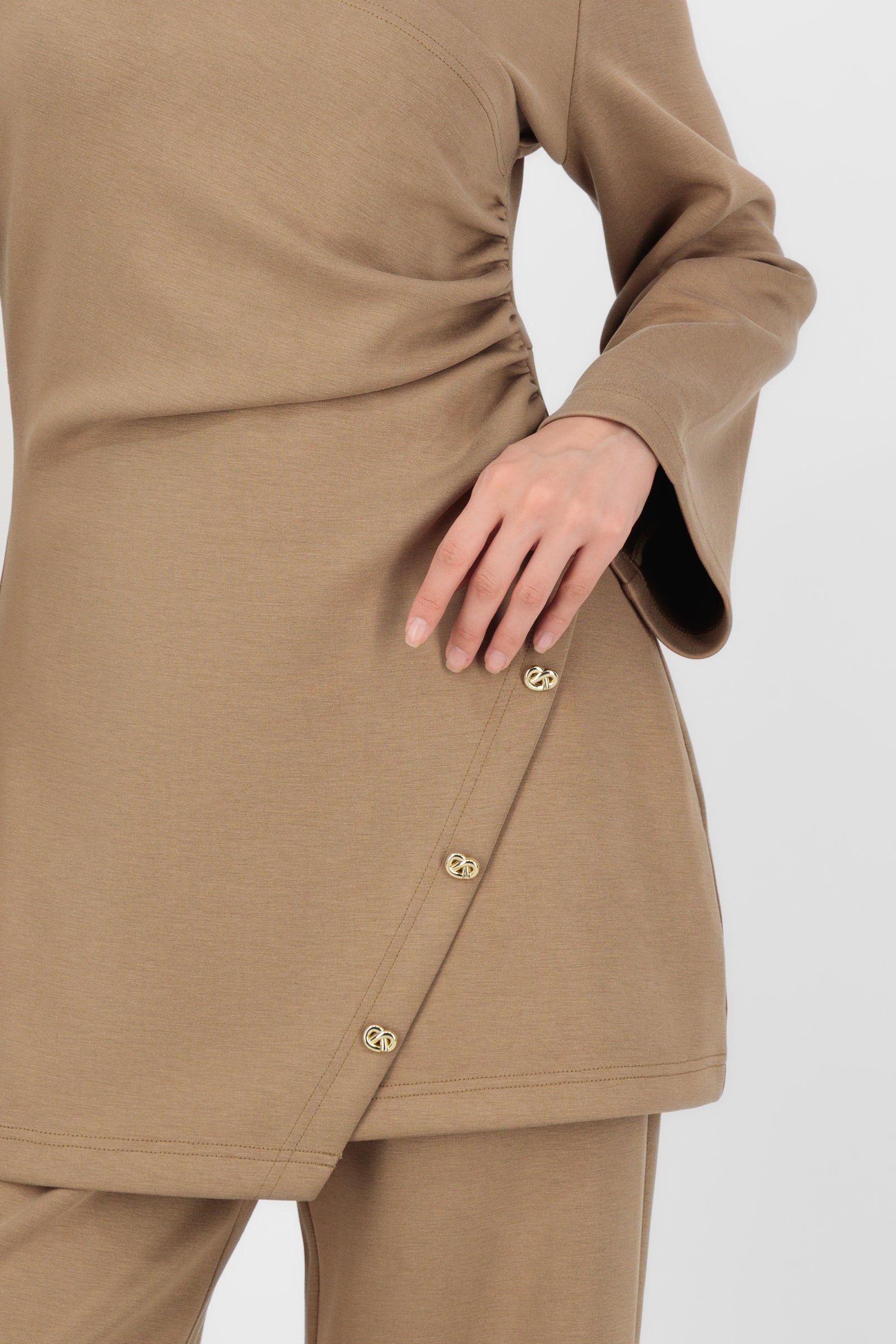 Close-up of the Buttery Side Ruched Tunic Toffee showing the gathered detail and buttery-soft fabric that make this one of the standout tunic tops in the collection.