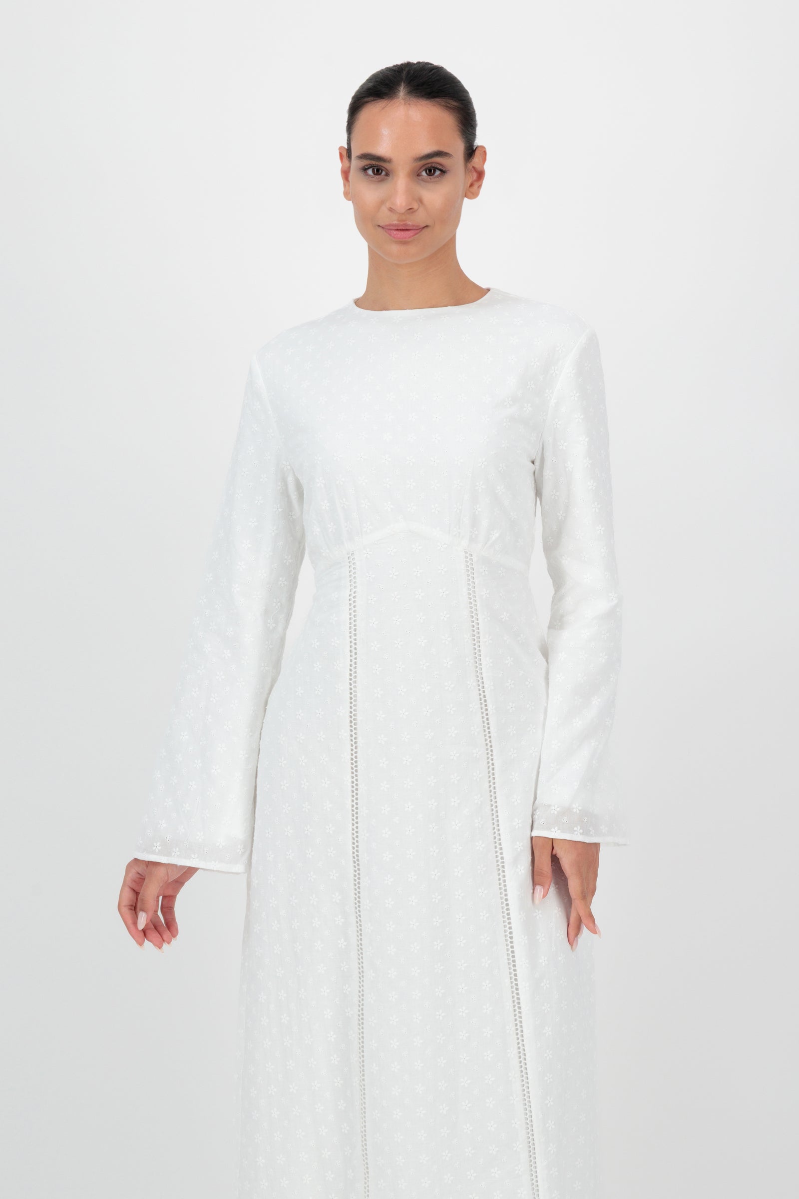 Front mid-length view of the FARES Embroidered Floral Dress in White emphasizes the embroidered texture and tailored fit of this elegant floral dresses for women design.