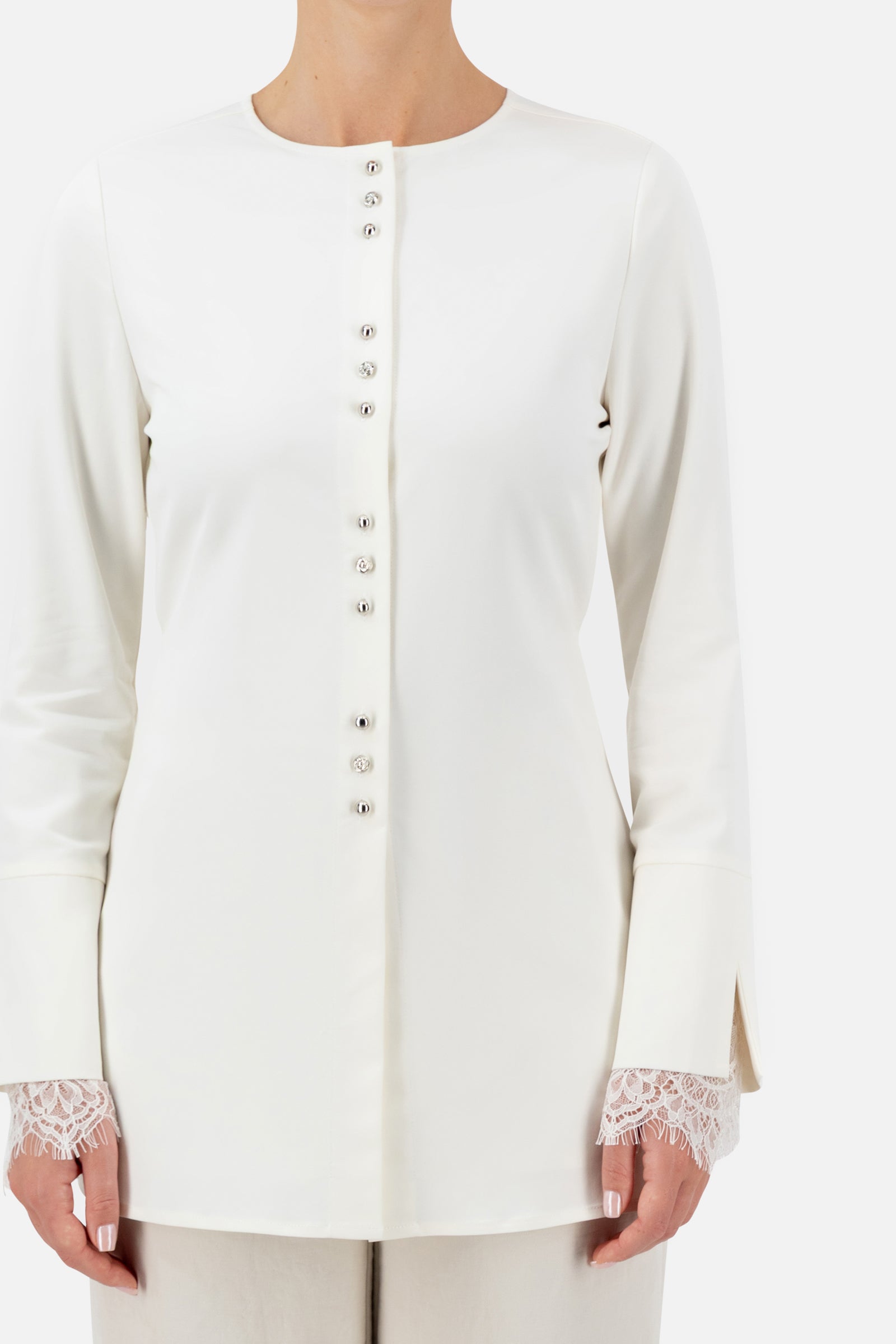 Close-up of the buttons and lace detail on the Sugar button-up long-sleeve top.