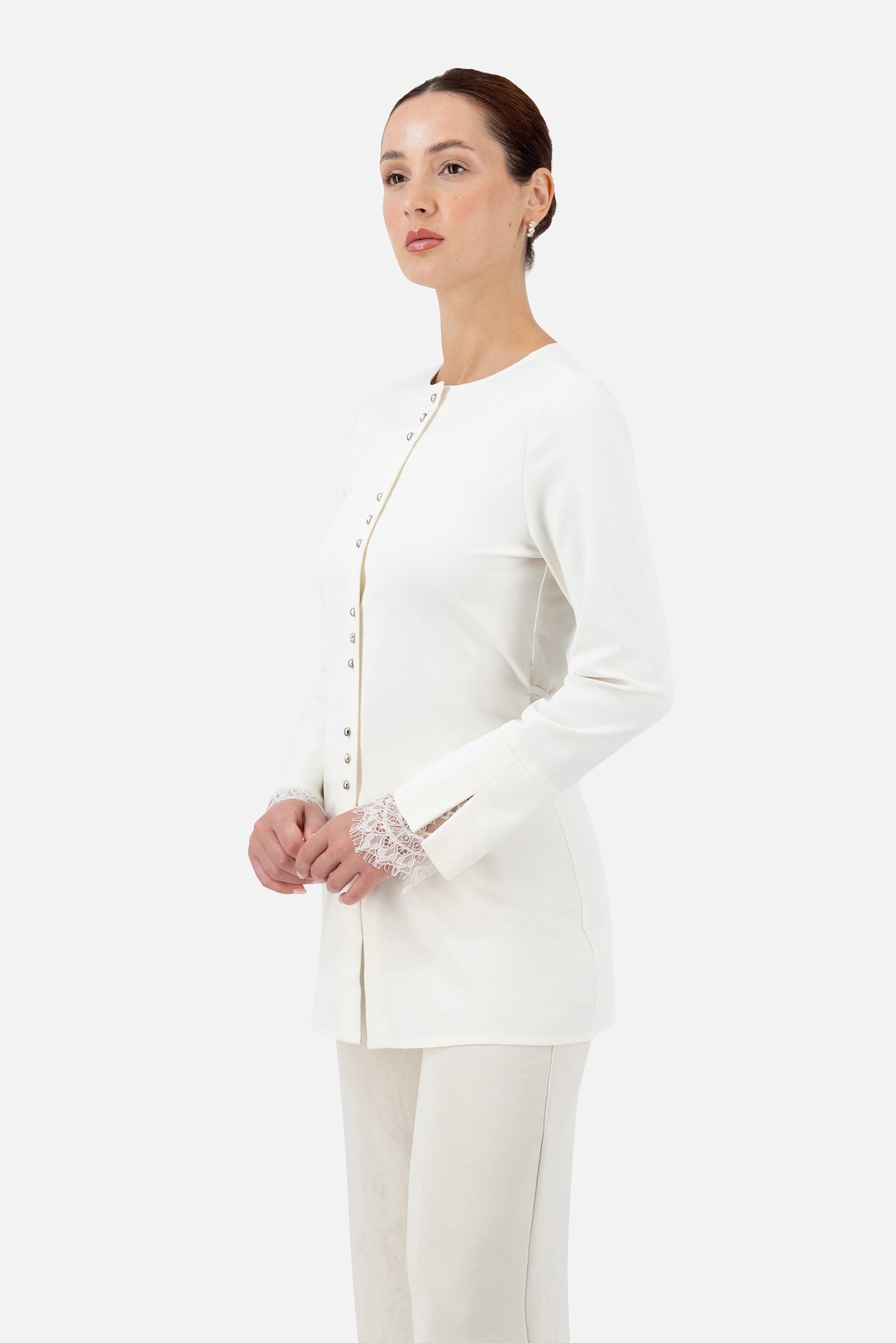 Woman wearing the Sugar button-up long-sleeve top, front view.
