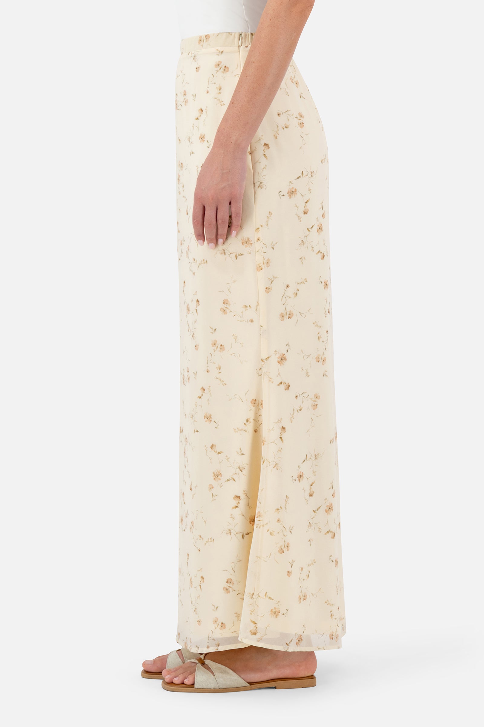 Side profile of the Butterbloom maxi skirt highlighting the full-length design and graceful drape.