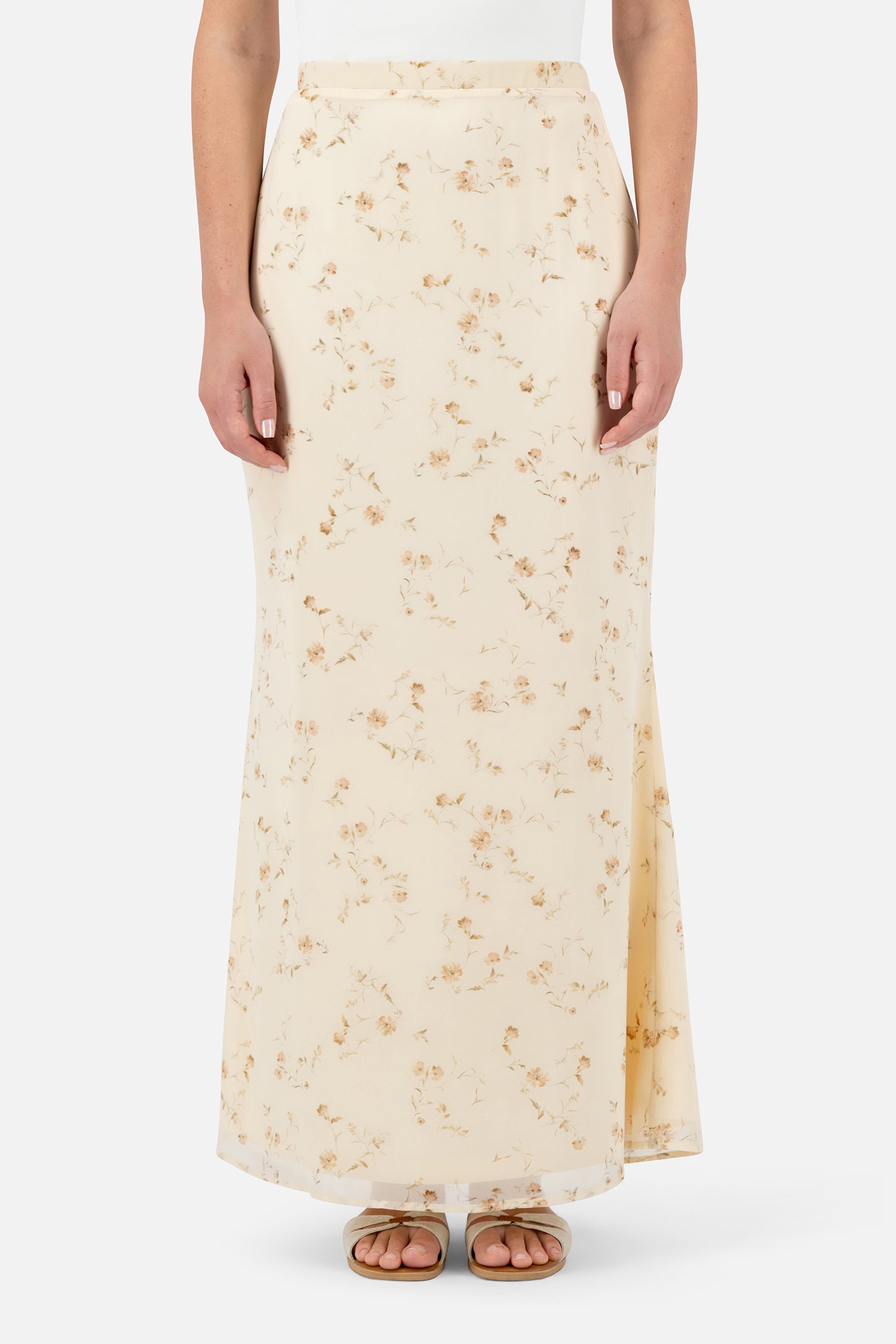 Woman wearing the Butterbloom tailored maxi skirt, front view with a flattering straight silhouette.