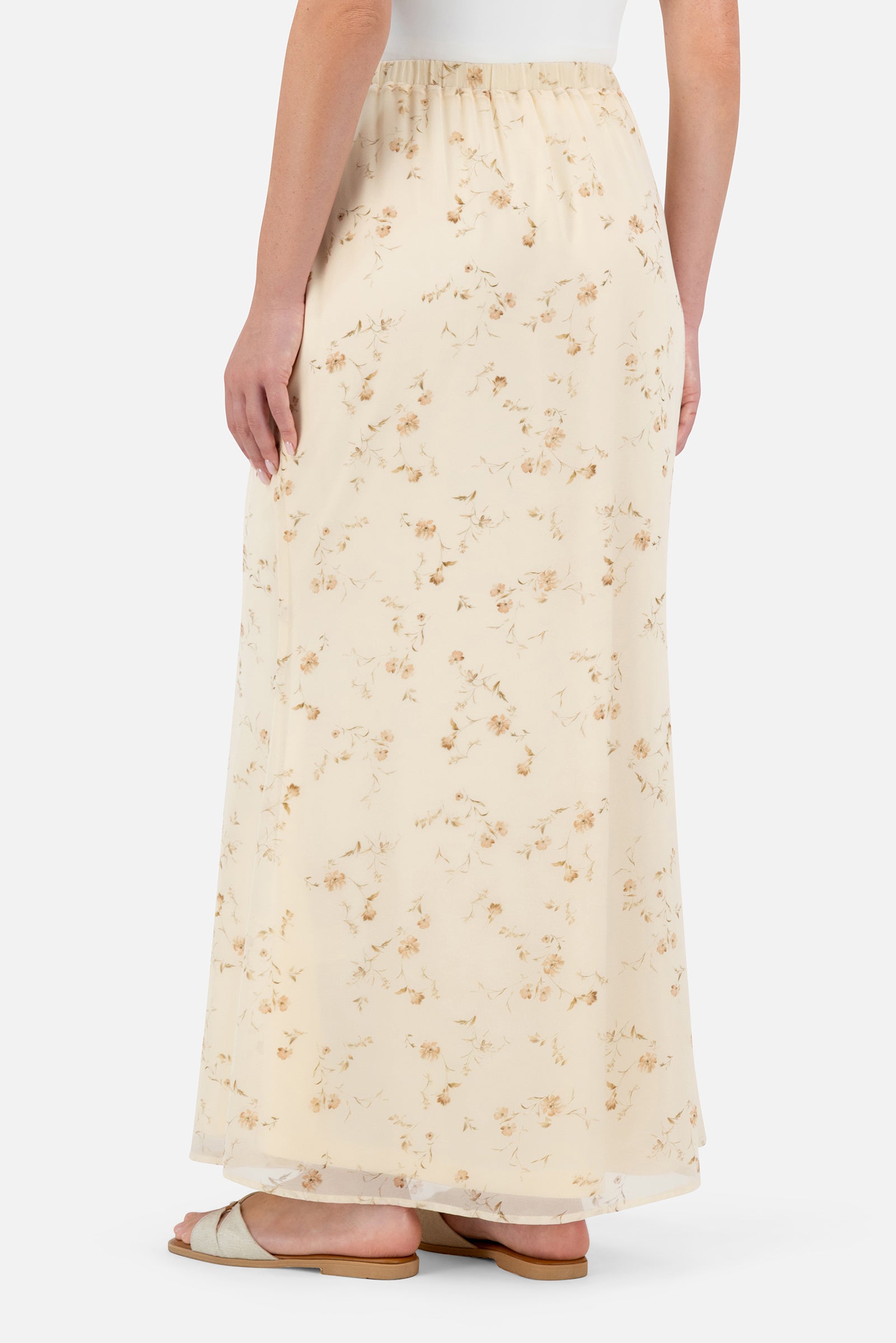 Back view of the Butterbloom maxi skirt showcasing the elegant floral print and tailored fit.
