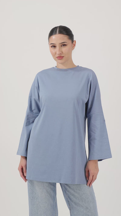 Model showcasing the Denim Blue Cotton Long-Sleeve Tee with effortless everyday style.