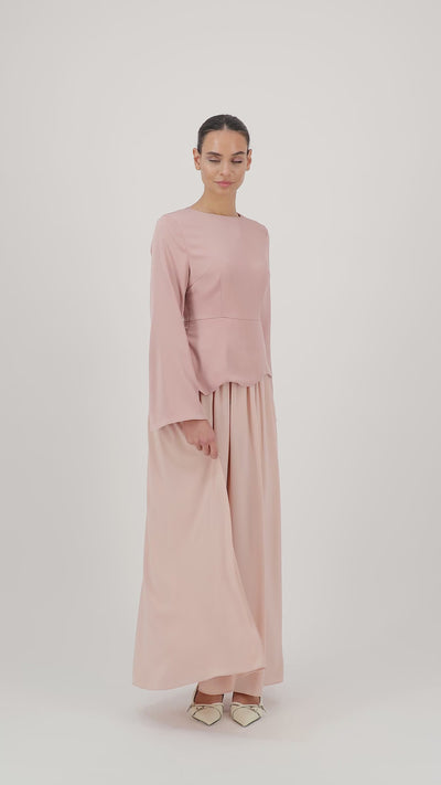 A model walks gracefully in the FARES Two Tone Scalloped Peplum Dress in Farawla, highlighting the flowing silhouette of this refined peplum dress designed for dresses for women.