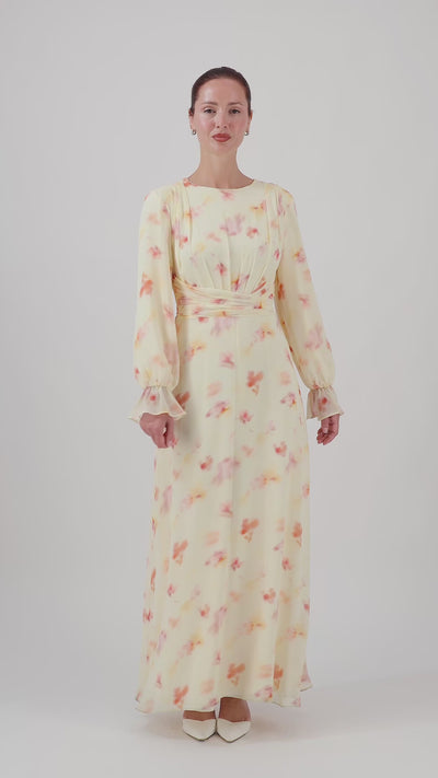 Video of the FARES Waist Wrap Chiffon Dress in Sunbloom, showing the movement and flowing silhouette of this floral dress for women.