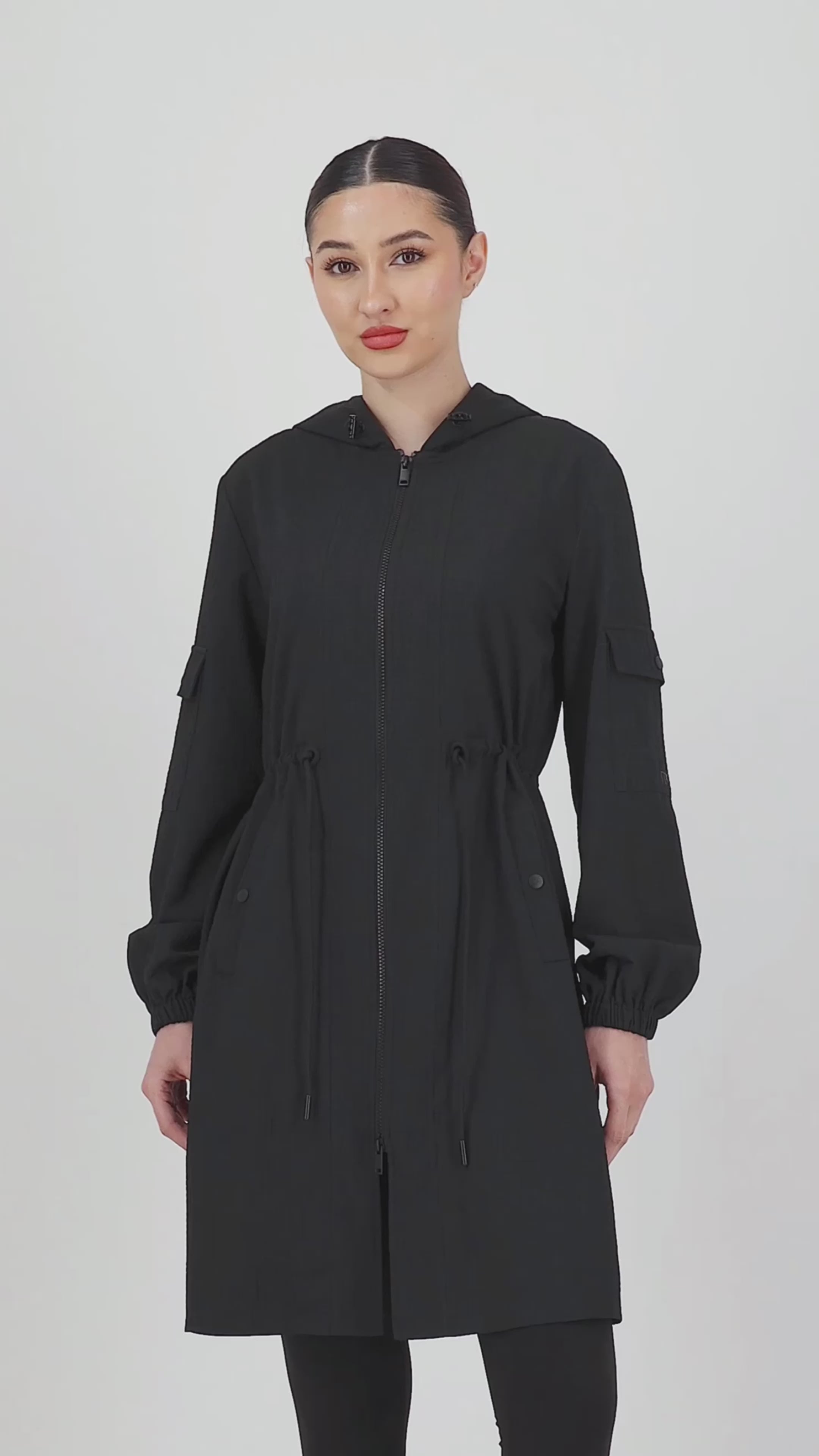 Video of the model moving in the CityLite Track Jacket Black, highlighting the clean lines and comfortable sporty fit that define this modern track jacket.