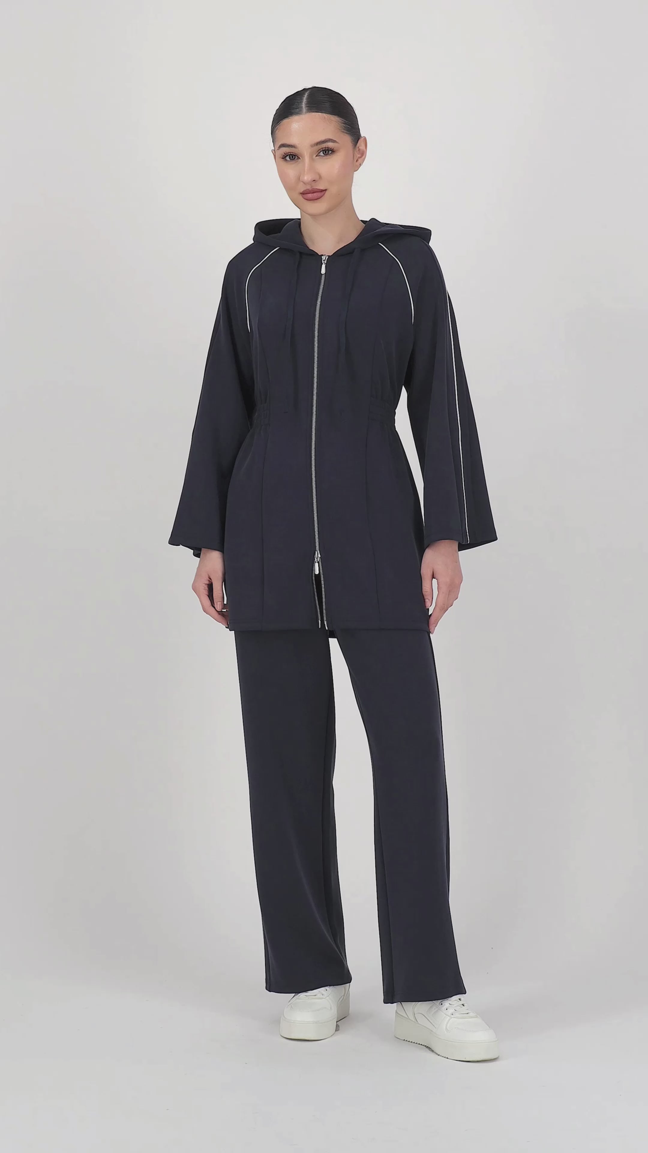 Video of the model walking in the Buttery Straight Leg Jogger Midnight Blue, highlighting the smooth movement and easy straight leg pants silhouette.