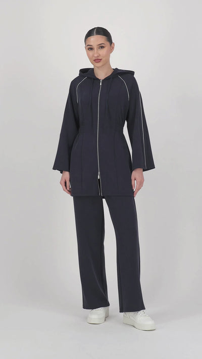 Video of the model walking in the Buttery Straight Leg Jogger Midnight Blue, highlighting the smooth movement and easy straight leg pants silhouette.