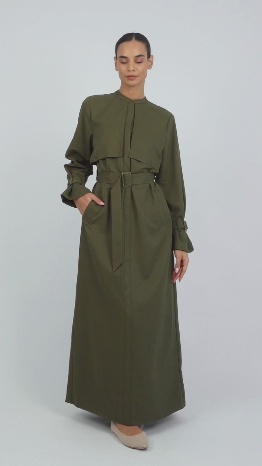 Colour: Khaki Green. A model is showing poses in a Trench Coat Dress.