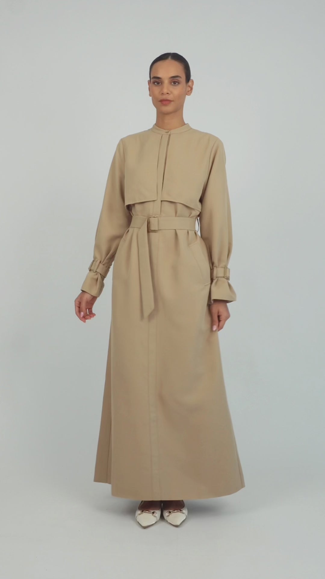 Colour: Tan. A model is showing poses in a Trench Coat Dress.