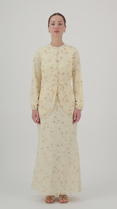 Model walks, turns from side to side and showcases the Butterbloom tailored maxi skirt in motion.