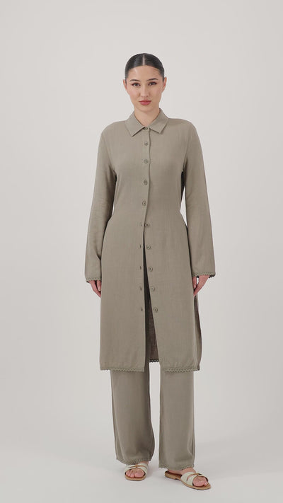 Woman showing the Haze Lace Trim Longline Button-Up while showcasing its relaxed fit and elegant movement.