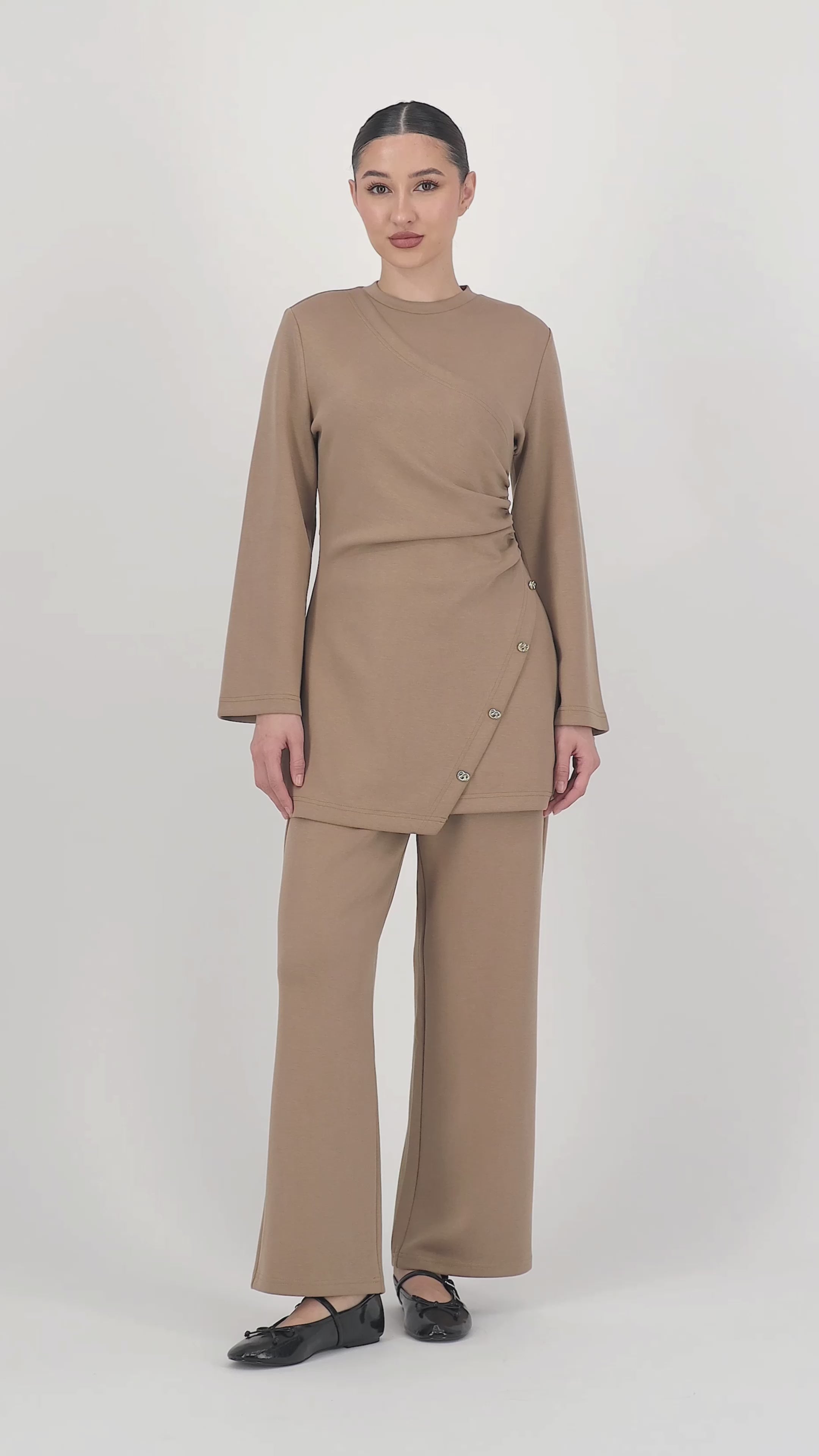 Video of the model walking in the Buttery Straight Leg Trousers Toffee, showing the soft movement and flattering straight leg trouser fit in motion.