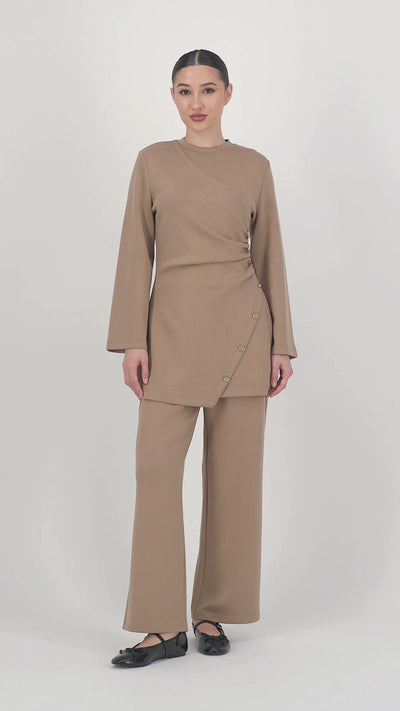 Video of the model walking in the Buttery Straight Leg Trousers Toffee, showing the soft movement and flattering straight leg trouser fit in motion.