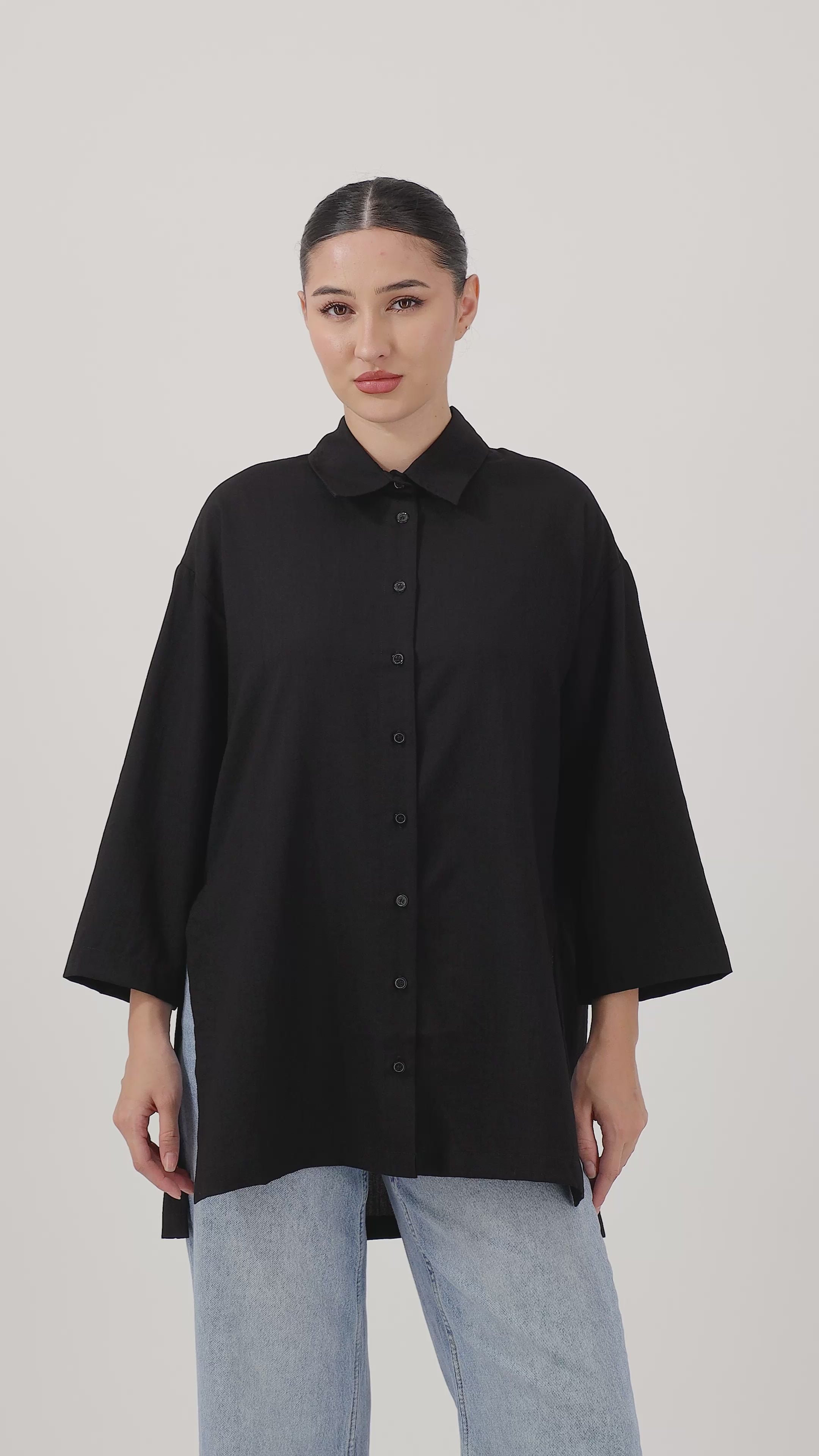 Woman wearing the Black Wide Sleeve Tunic with effortless movement and everyday style.